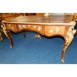 A Louis XV style tulipwood writing table with deco