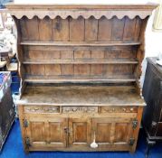 A good, early 18thC. oak dresser with drawers & cupboards under, 76in high x 62in wide x 22in deep.