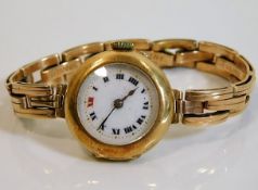 A ladies 18ct gold cased wrist watch with 15ct gol