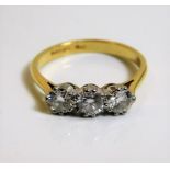 An 18ct gold trilogy ring set with approx. 1ct diamond 3g M/N