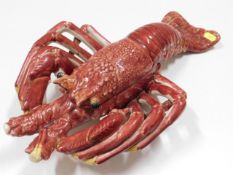 A large continental majolica lobster, centre repai