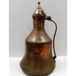 A large 18thC. Persian copper water jug 21in tall