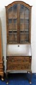 A 19thC. slimline bureau bookcase 79in high x 24in