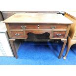 An antique mahogany lowboy. Provenance: From Grade