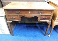 An antique mahogany lowboy. Provenance: From Grade