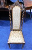 A 19thC. oak Abbotsford style chair with barley tw