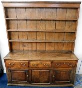 An 18thC. oak dresser with brass fittings to drawe