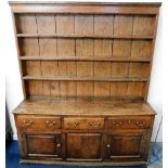 An 18thC. oak dresser with brass fittings to drawe