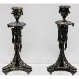 A pair of silvered bronze Regency period candlesti