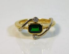 An 18ct gold ring set with green garnet & diamond