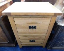 A modern solid oak filing cabinet 33.5in high x 24