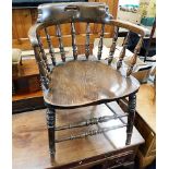 A 19thC. elm smokers chair. Provenance: From Grade