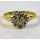 A 18ct gold daisy ring with illusion set diamonds