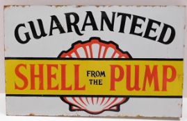 A large double sided enamel sign of motoring interest "Guaranteed Shell from the Pump" 24in wide x 1