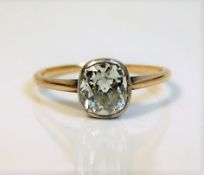A 19thC. rose gold coloured ring set with a cushion cut diamond of approx. 1.5ct, 1.8g size N, diamo