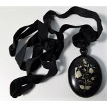 A Victorian tortoiseshell mourning locket with inl