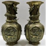 An impressive large pair of Chinese late Qing dynasty brass dragon vases with good detailed decor &