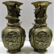 An impressive large pair of Chinese late Qing dynasty brass dragon vases with good detailed decor &