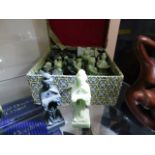 A boxed set of Oriental style resin chess pieces