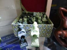 A boxed set of Oriental style resin chess pieces