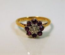 An 18ct gold ring set with ruby & diamond 3g size K