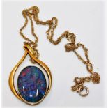 A 9ct gold chain 14" long & pendant with a black opal doublet