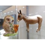 A Beswick donkey twinned with Beswick Beatrix Pott