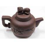 A Chinese Yixing clay teapot with lion decor finia