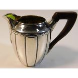 A good 19thC. French 0.950 silver cream jug with rosewood handle 88.2g inclusive