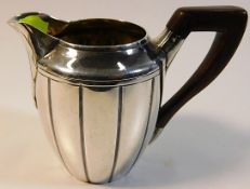 A good 19thC. French 0.950 silver cream jug with rosewood handle 88.2g inclusive