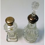 Two silver topped scent bottles