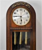 An oak long case 1920's H.A.C clock, lacking dial