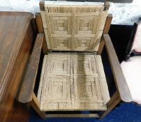 An arts & crafts style rush seated arm chair with