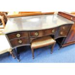 A mahogany lowboy with leatherette top & cane stoo