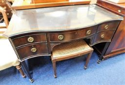 A mahogany lowboy with leatherette top & cane stoo