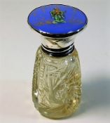 A silver topped scent bottle with enamel style déc