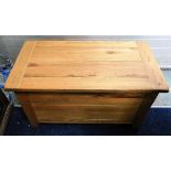 A modern solid oak blanket box 36in wide x 19in de