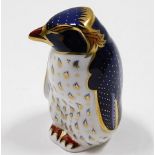 A Royal Crown Derby Rockhopper paperweight with go