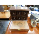 A wooden jewellery chest twinned with a brass inla