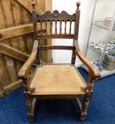 A late Victorian oak rush seated throne style chai