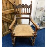 A late Victorian oak rush seated throne style chai