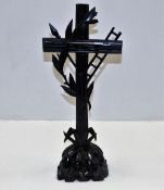 An early 20thC. tall lacquered wooden cross with naturalistic base 16" high