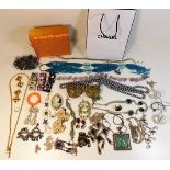 A quantity of costume jewellery including two bras