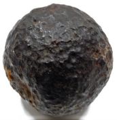 An early iron cannon ball 5in diameter