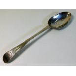 A Georgian bright cut patterned spoon by George Gr