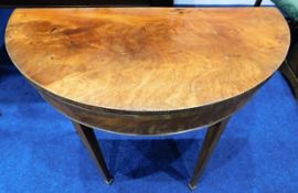 A Georgian mahogany folding card table with ebony