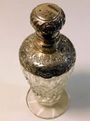 A decorative silver topped scent bottle 6in tall