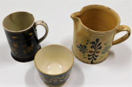 A 19thC. Scottish slipware jug 5.25in high, a Vict