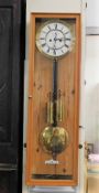 A German Vienna style clock in later case 31.5in h