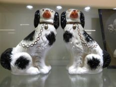 A pair of Staffordshire style spaniel dogs